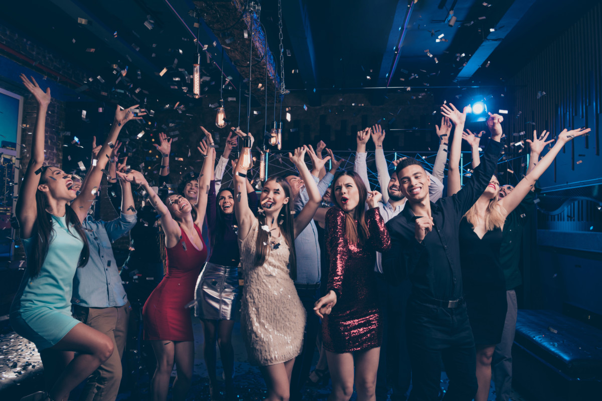 Portrait of good-looking festive lady guy having fun raise hands arms shout laugh, emotional have vent holidays free time rejoice suit dress discotheque